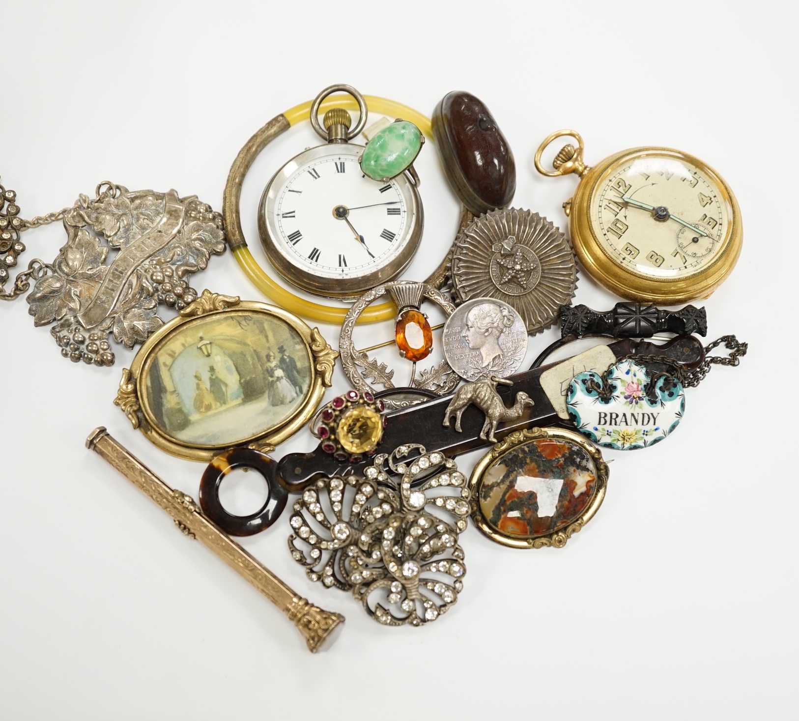 An interesting group of Victorian and later bijouterie, including mourning brooch, paste buckle, pocket watches, rings, wine label, etc.